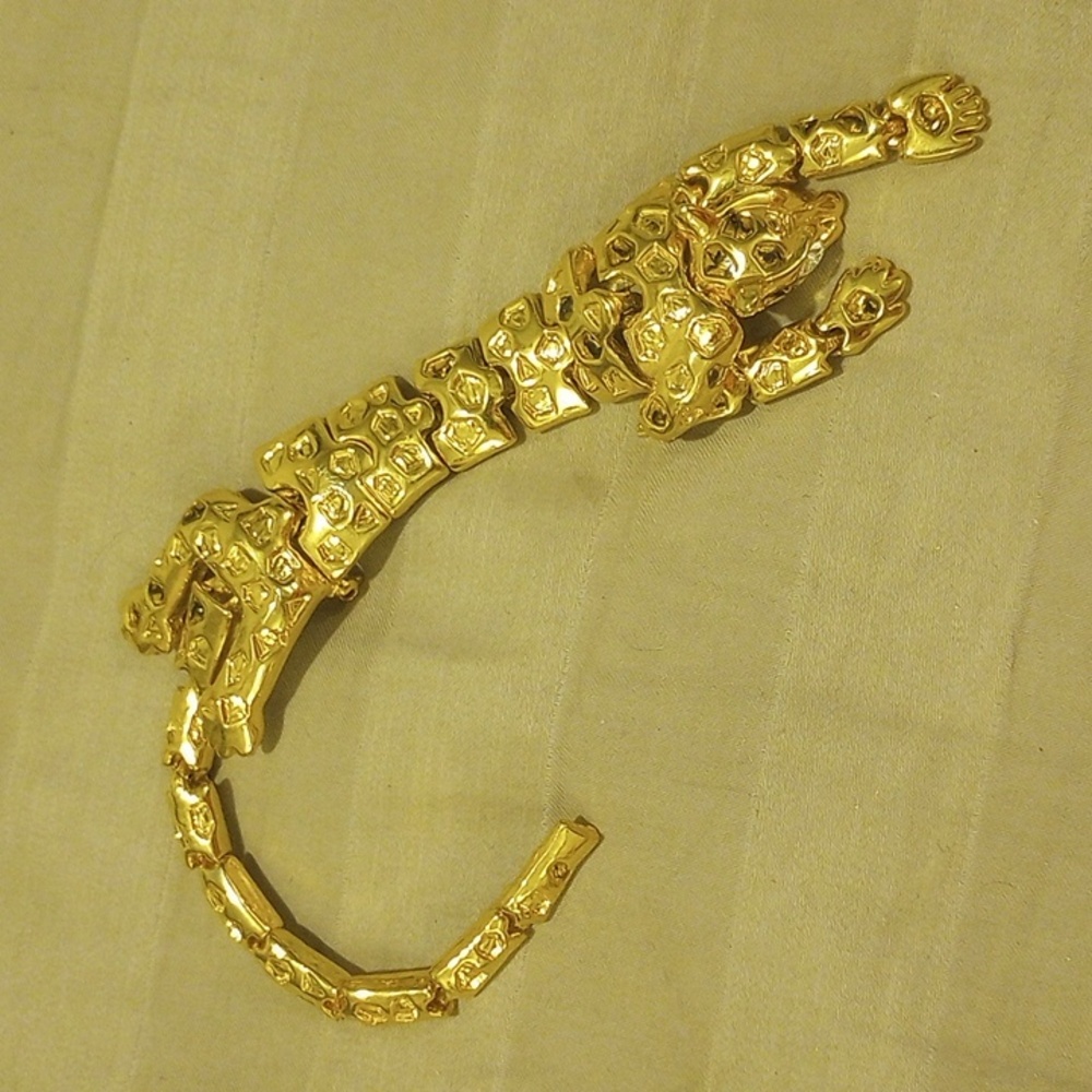 Gold tone articulated brooch, EUC